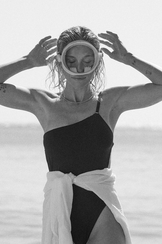 woman with goggle on her face. black and white image
