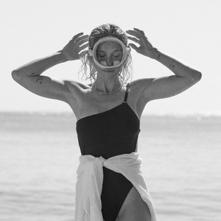 woman with goggle on her face. black and white image